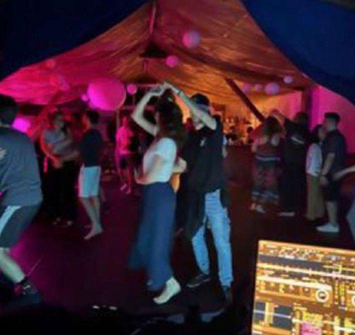 Magical night dancing under colorful lights